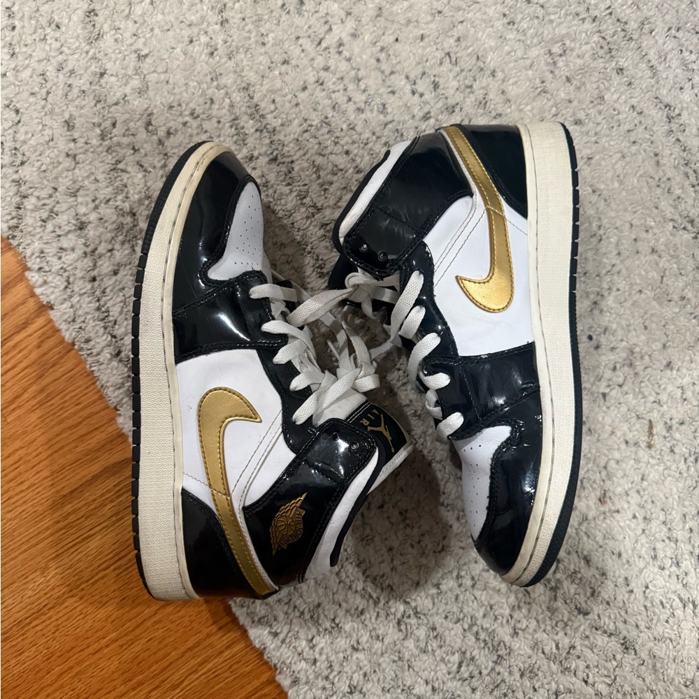Nike Black and Gold Jordan 1 Mid